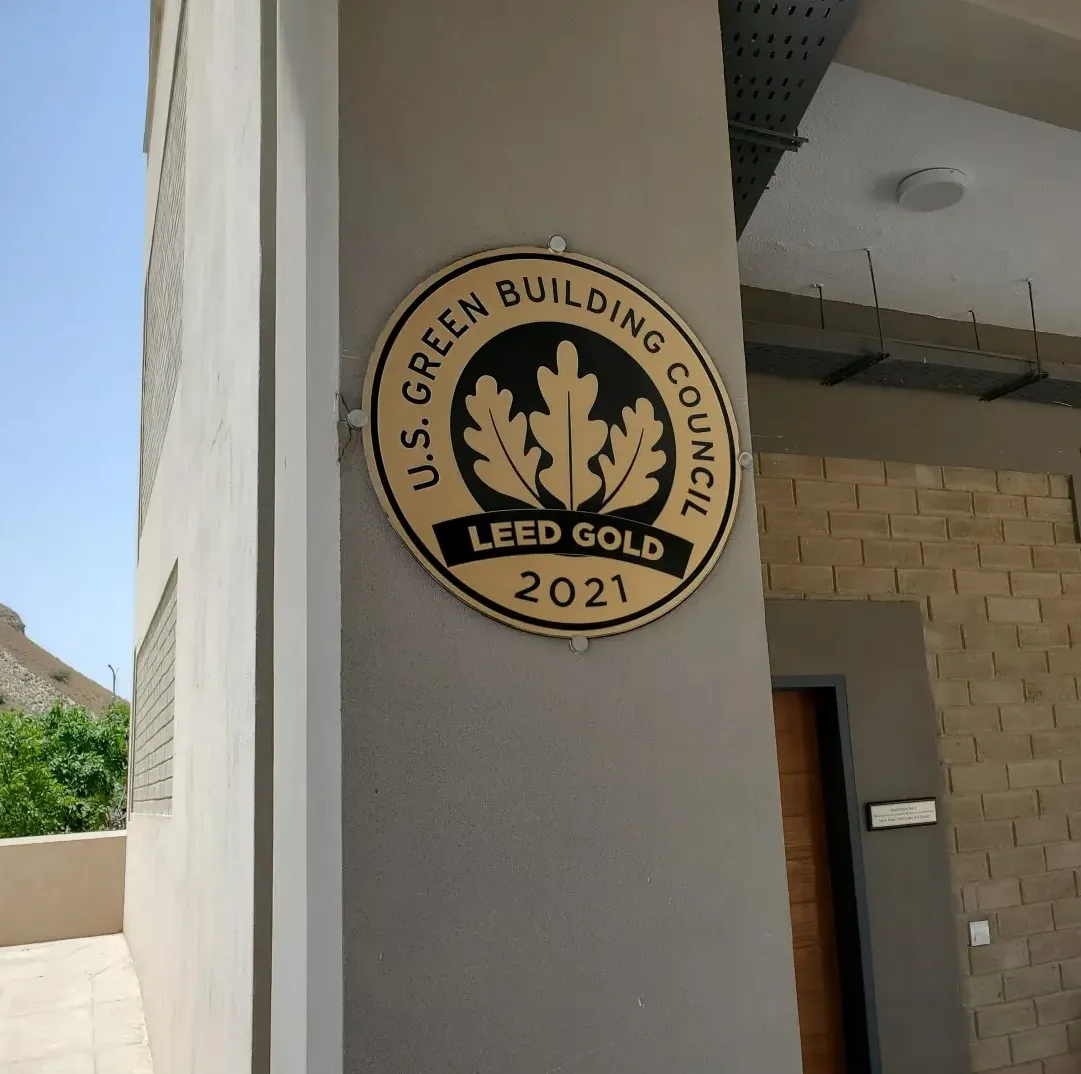 LEED Gold certification plaque mounted at the entrance, Namal University - Agri Business Building, Mianwali. LEED Gold-certified educational building. Photo: Namal University / Eco Enterprises.